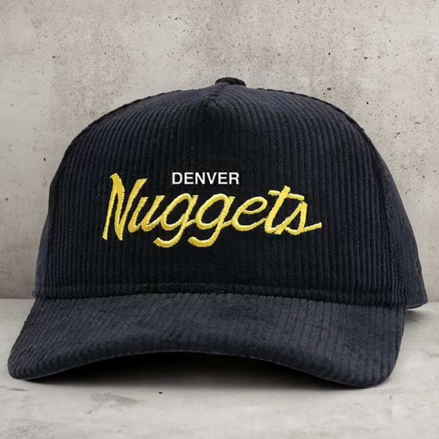 VINTAGE SCRIPT SNAPBACK (BLACK CORD) - Vintage Nuggets Snapbacks: Retro gold, mined from the depths of basketball history. Corduroy with timeless style. Grab a piece of the past before it's just a memory. ***THESE HATS SHIP LAST WEEK OF MAY*** If you orde